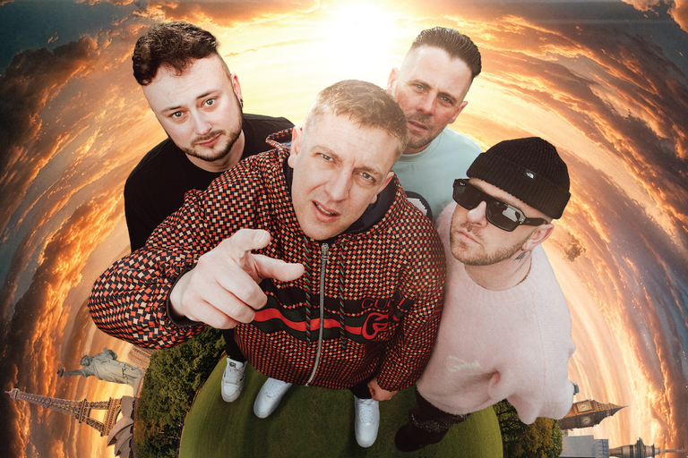 Indie rock band The Reytons posing together in a fisheye-lens shot against a fish-eye globe and sunset sky.